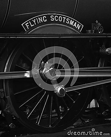 Flying Scotsman Steam Engine - close up of name plate and wheel Editorial Stock Photo