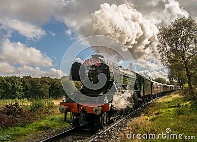 The Flying Scotsman coming around a curve on a slight incline Stock Photo