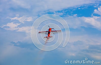 Flying in the sky on a background of clouds the plane. Stock Photo