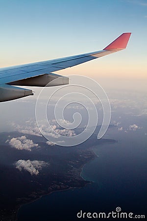 Flying to the mainland during Sun set Stock Photo