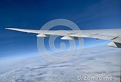 Flying wings of an aircraft in the sky unique photo Stock Photo