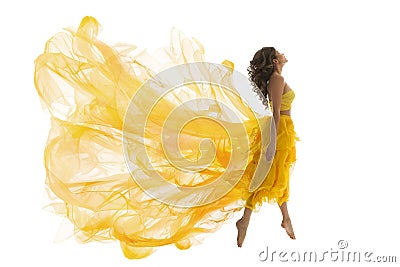 Flying Woman Levitation Jump, Fashion Model in Fly Yellow Dress Stock Photo