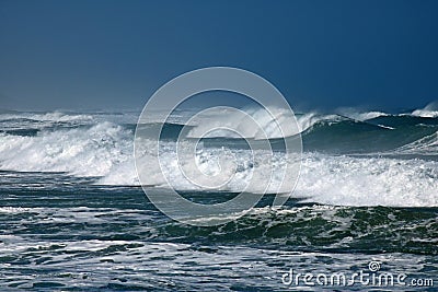 FOAM BLOWING OFF THE CRESTS OF WHITE WAVES Stock Photo