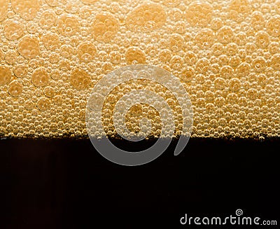 Foam from dark beer with bubbles Stock Photo