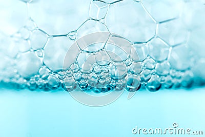 Foam. Soap foam popping bubbles background. Soap sud macro structure. Soap foam close-up Stock Photo