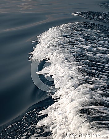 Foam wave on a deep blue sea Stock Photo