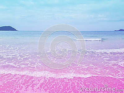 Foamy Rippled Clear Sea Wave Rolling to Pink Sand Shore Turquoise Blue Water. Beautiful Tranquil Idyllic Scenery. A cotton candy Stock Photo