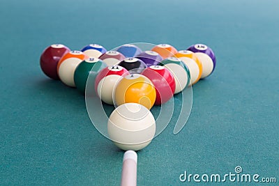 Focus on cue aiming white ball to break snooker billards Stock Photo