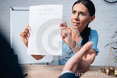 Focus of displeased and brunette client Stock Photo