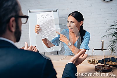 Focus of displeased and brunette client Stock Photo
