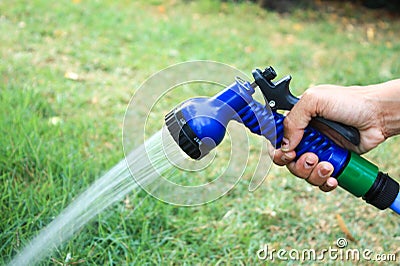 Focus on the hand image Tree sprinkler Stock Photo