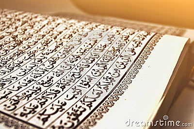 focus holly quran on low light sunset or sunrise moslem with verses ramadhan fasting Stock Photo