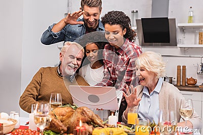 Focus of multicultural family having video Stock Photo