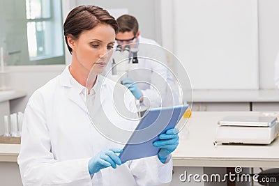 Focus scientist using tablet pc Stock Photo