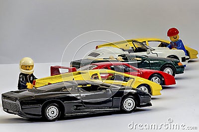 Focus-stacking with Lego figures next to a row of toy cars entirely in focus Editorial Stock Photo