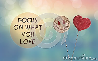 Focus on what you love with heart and smile emoji Stock Photo