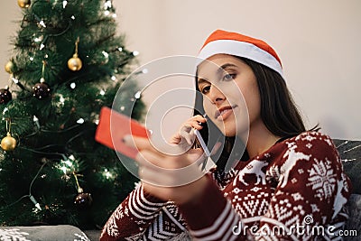 In focus woman buying gifts on the phone Stock Photo