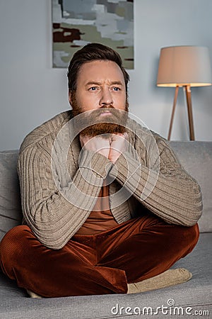 Focused bearded man looking away while Stock Photo