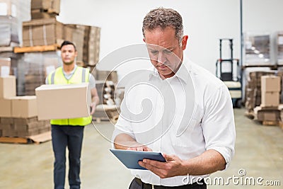 Focused boss using digital tablet Stock Photo