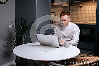 Focused business man typing on laptop doing search Stock Photo