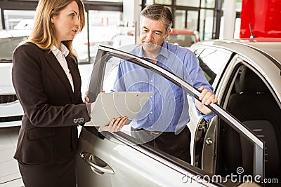 Focused businessman undersign a car contract Stock Photo