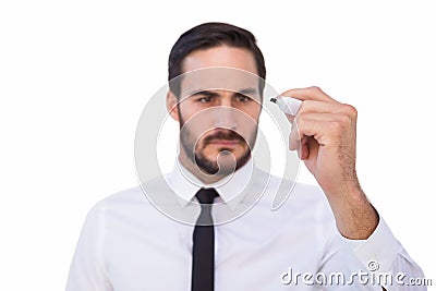 Focused businessman writing with marker Stock Photo