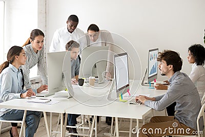 Focused multiracial business people working online on computers Stock Photo