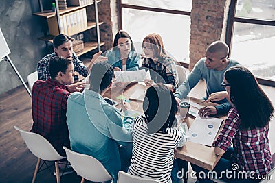 Focused concentrated motivated managers coworkers associates professionals in casual shirts leader leadership have Stock Photo