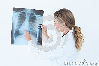 Focused doctor looking at xray Stock Photo