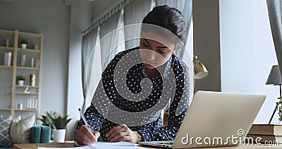 Focused Indian Businesswoman Using Laptop Thinking Doing Research In Office Stock Footage