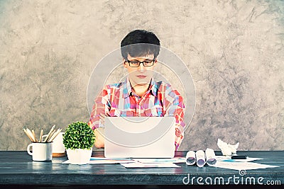 Focused man using laptop front Stock Photo