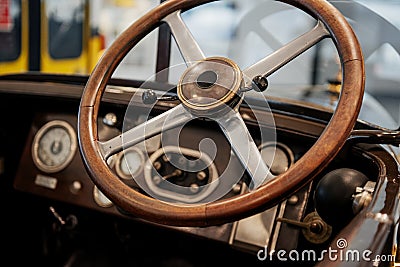 Focused photo of the brown steering wheel of an old retro automobile Editorial Stock Photo