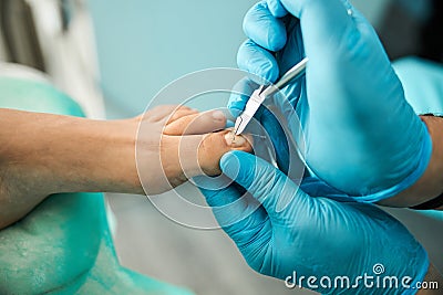 Focused photo on male hands holding nail clippers Stock Photo