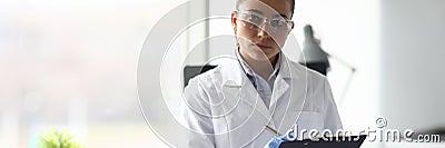 Focused researcher in light working room Stock Photo