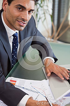 A focused sales person studying statistics Stock Photo