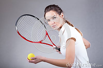 Focused woman playing tennis Stock Photo