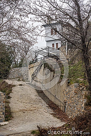 Fog above traditional houses in Milies village on mountain Pelion.Greece Stock Photo