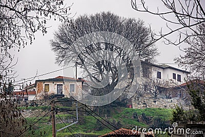 Fog above traditional houses in Milies village on mountain Pelion.Greece Stock Photo