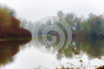 Fog and autumn colors landscape of Mission Lake, Oregon Stock Photo