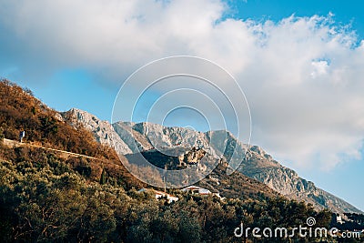 Fog is falling on mountain as sun goes down. Nice as desktop background. Stock Photo