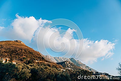 Fog is falling on mountain as sun goes down. Nice as desktop background. Stock Photo