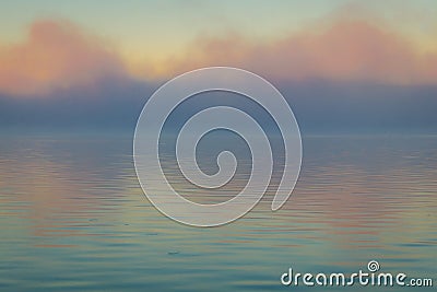 Fog creates a muted palette at dawn on Silver Lake, Castile, NY, in early fall Stock Photo