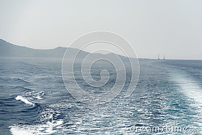 Fog over the sea. Waves and wake of the boat Stock Photo