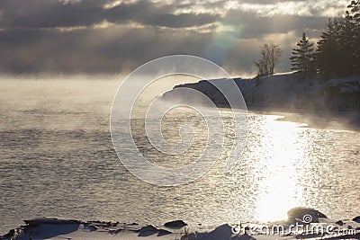 Fog settling over a cold Lake Superior Stock Photo