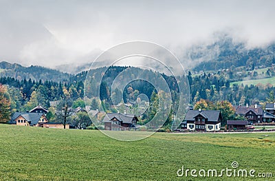 Foggy autumn view of Brauhof village. Amazing morning scene of Austrian Alps, Styria stare of Austria, Europe. Beauty of Stock Photo