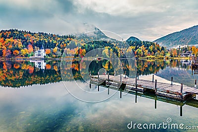 Foggy autumn view of Grundlsee lake. Wonderful morning scene of Brauhof village, Styria stare of Austria, Europe. Colorful view of Stock Photo