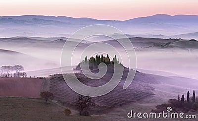 Foggy dawn on countryside hills Stock Photo