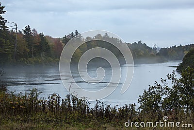 Foggy, dreary fall day on the Androscoggin River, New Hampshire. Stock Photo