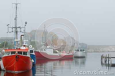 Red Boats in Foggy Harbor Editorial Stock Photo
