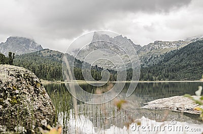 A foggy landscape, a view of the cliffs, the forest and lake, Ergaki mountains Stock Photo